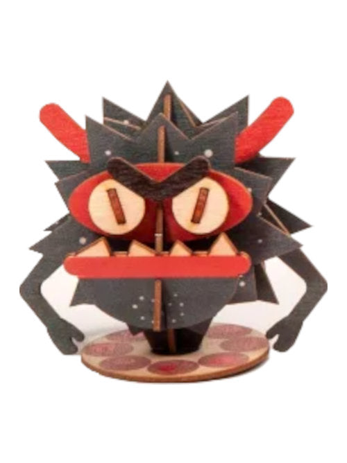 Completed small monster wooden 3D greeting card with assembled red monster decoration.