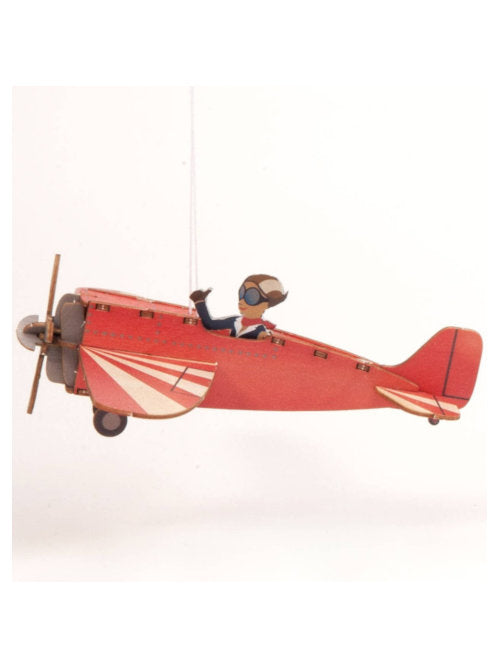 Completed airplane wooden 3D greeting card with assembled red airplane decoration.