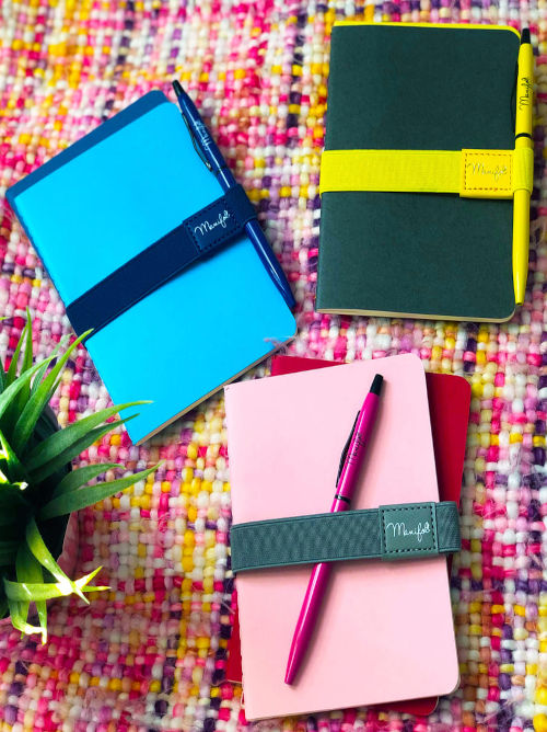 Bold coloured A6 notebook sets with matching recycled pen & elastic closure. Three colour options shown in image