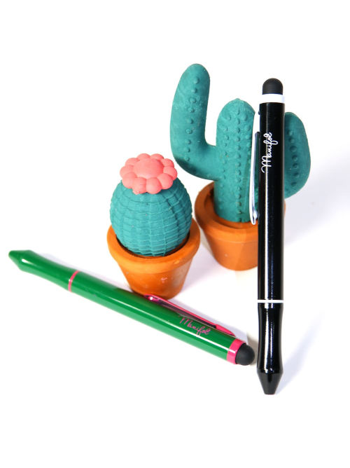 Dual-ink recycled metal ballpoint pen shown in everyday writing use