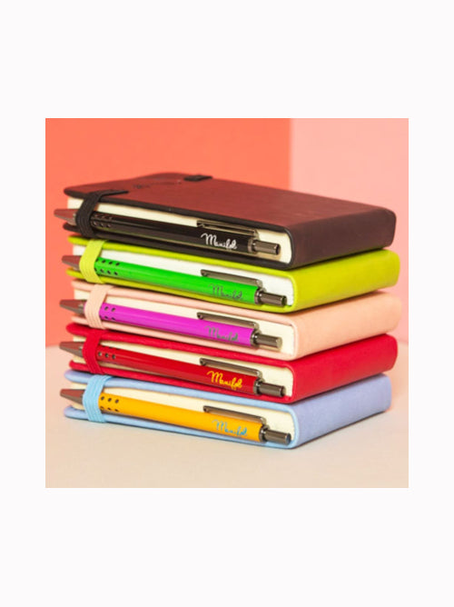 Stack of pocket-sized notebooks with matching metallic pens, available in multiple colours