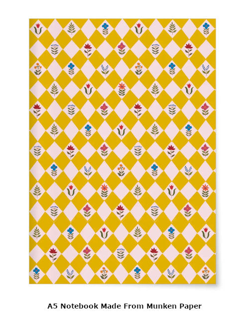 Striking yellow notebook cover with diamond geometric grid pattern and small flowers inside the diamond