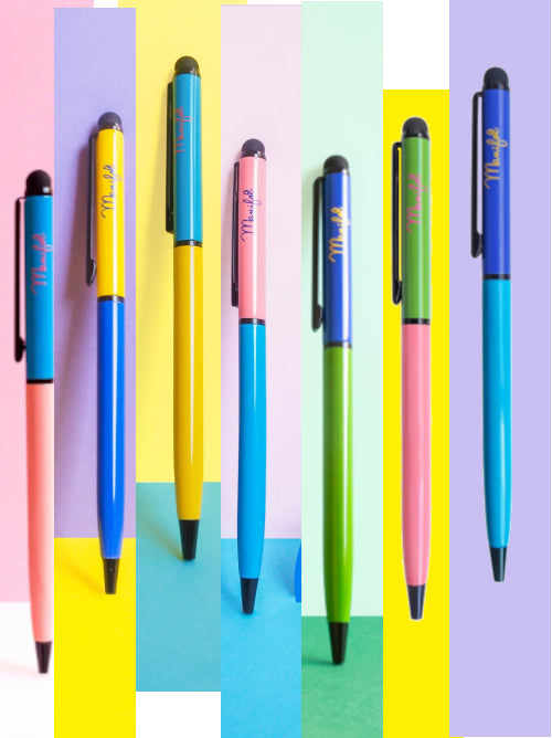 Colour-block recycled metal ballpoint pens in bright two-tone designs, shown across pastel and bold backgrounds.