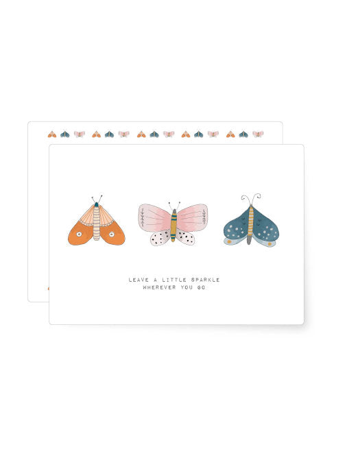Illustration of three decorative butterflies in soft colours, arranged in a simple and uplifting design.