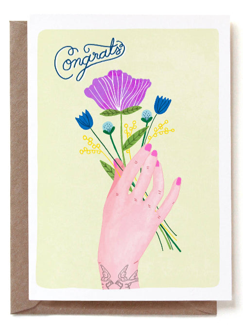 Greeting card with hand holding flowers and 'Congrats' text on a light yellow background