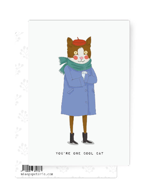 Illustrated cat wearing a beret, coat and scarf holding a warm drink, humorous cool cat postcard.