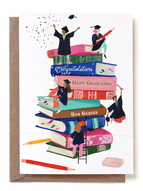 Graduation-themed greeting card with mini graduates sitting on and around a stack of books. 