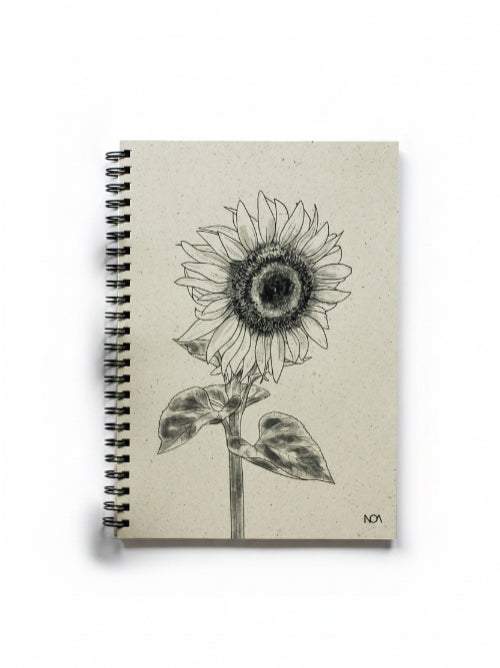 Spiral-bound, grass paper notebook with a sunflower illustration on a white background