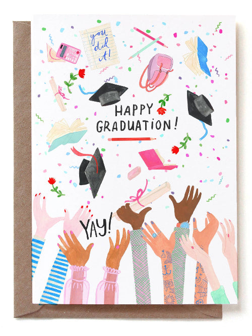 Graduation card with colorful illustrations of hats flying up in the air and 'Happy Graduation!' text