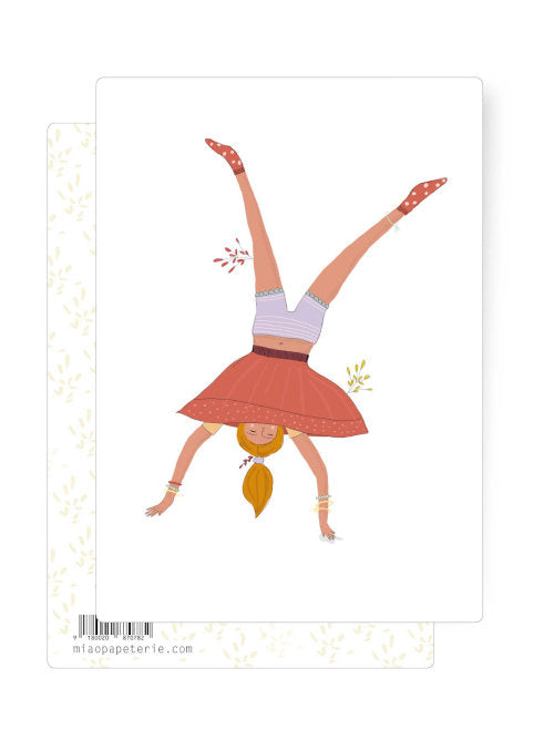 An illustration on a postcard of a woman doing a cartwheel implying freedom from the normal. 