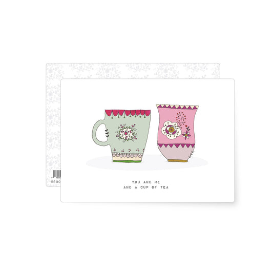 Illustrated postcard showing two decorative mugs with the phrase you and me and a cup of tea.