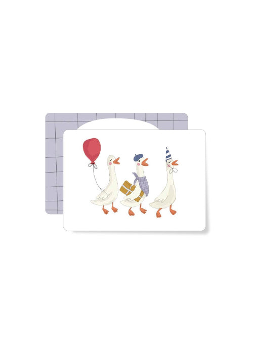 Illustration of three geese marching together, one with a red balloon, one carrying a present, and one wearing a party hat on a playful birthday mini card.