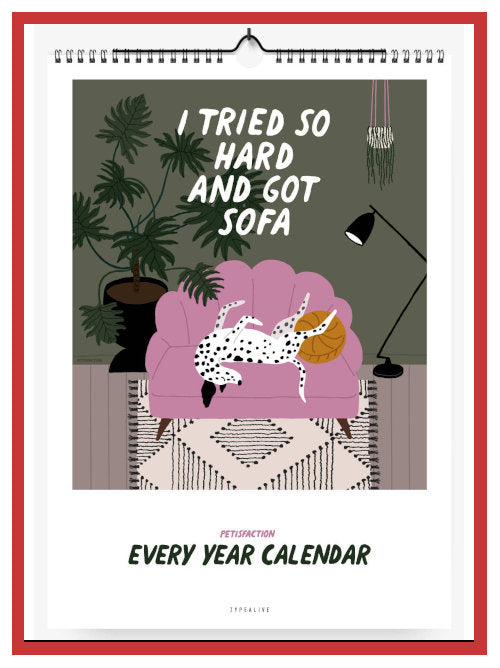 Front cover of an undated wall calendar with an illustrated dog resting on a sofa in a living room scene.