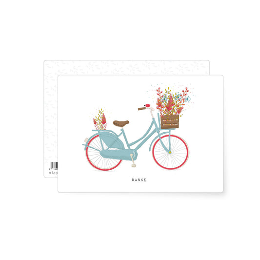 Illustration of a pastel blue vintage bicycle with a basket full of colourful flowers and the word danke, cheerful thank you postcard with a playful illustrated style.